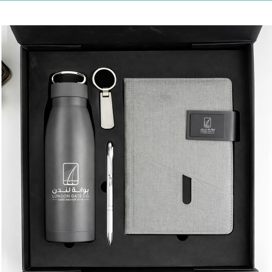 Notebook and bottle set on a wooden desk